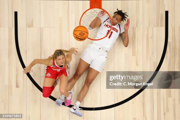 Jacy Sheldon of the Ohio State Buckeyes and D'asia Gregg of the Virginia Tech Hokies look on during the Elite Eight round of the 2023 NCAA Womens...