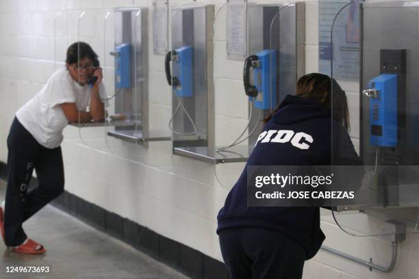 Female detainees make phone calls in the Alpha Unit of Port Isabel detention facility in Texas, United States on December 17, 2008. Port Isabel,...