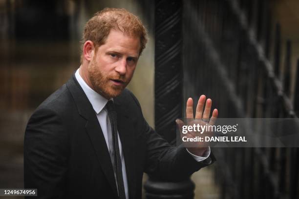 Britain's Prince Harry, Duke of Sussex waves as he arrives at the Royal Courts of Justice, Britain's High Court, in central London on March 28, 2023....