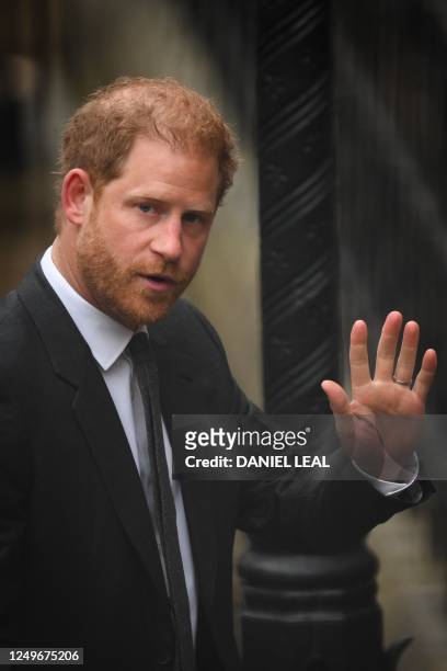 Britain's Prince Harry, Duke of Sussex waves as he arrives at the Royal Courts of Justice, Britain's High Court, in central London on March 28, 2023....