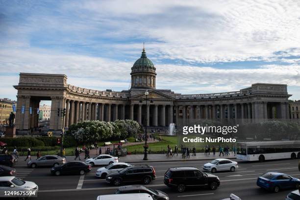 People walking and vehicles are seen in front of Kazan Cathedral church in Saint Petersburg, Russia, on May 22, 2019.
