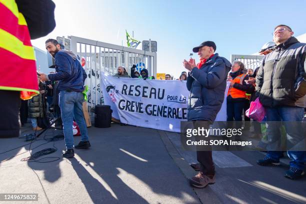 People are seen blocking the Ivry-sur-Seine waste incinerator centre. Garbage collectors, trade unionists, students, and railway workers blocked the...