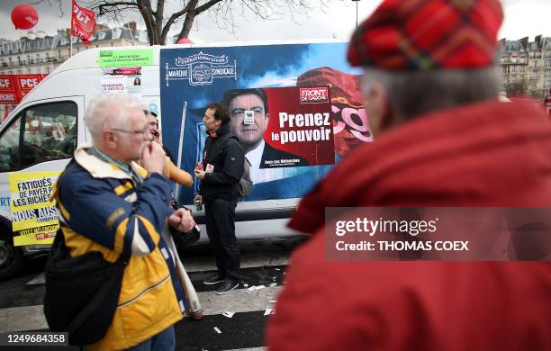 Supporters of French Front de Gauche candidate for the 2012 French presidential election Jean-Luc Melenchon prepare for a march from Nation to...