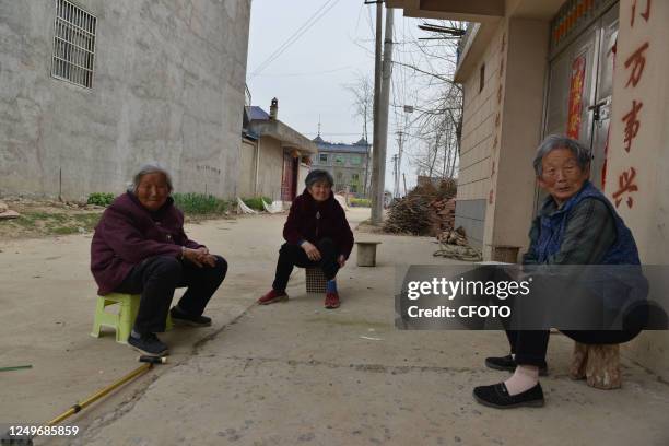 Several villagers chat in a rural area of Linquan county, Fuyang city, East China's Anhui province, March 28, 2023. Nowadays, there is a phenomenon...