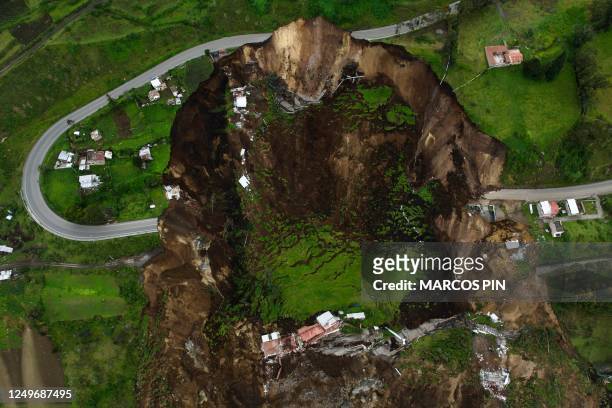 Aerial view of the zone affected by a landslide in Alausi, Ecuador on March 28, 2023. - Rescuers searched Monday for more than 60 people reported...