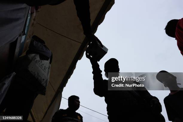 Number of residents queue to get iftar snacks on Jalan Raya Tegar Beliman, Cibinong, Bogor Regency, West Java, Tuesday . The Bogor government...