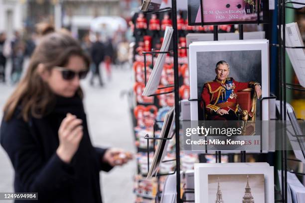 Postcard image showing a smiling King Charles III in ceremonial military uniform outside the Cool Britannia Souvenir shop at Leicester Square on 27th...