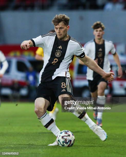 Luca Netz of Germany passes the ball during the International Friendly match between U21 Romania and U21 Germany at Municipal Stadium on March 28,...