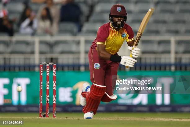 West Indies' Raymon Reifer watches the ball as he runs between the wickets during the third T20 international cricket match between South Africa and...