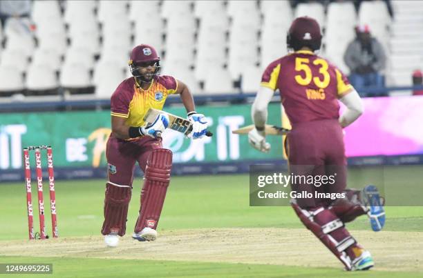 King and Pooran of the West Indies during the 3rd KFC T20 International match between South Africa and West Indies at DP World Wanderers Stadium on...