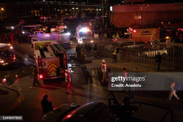 Personnel take measures at the scene after a fire broke out at a migration facility killing at least 39 migrants in the Mexican northern border city...