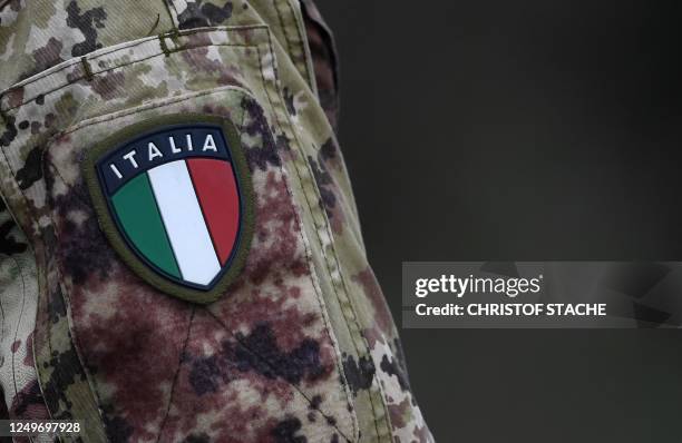 Soldier of the Italian army wears the country's flag on his uniform during the 'Dynamic Front 23, the US Army led NATO and Partner integrated annual...