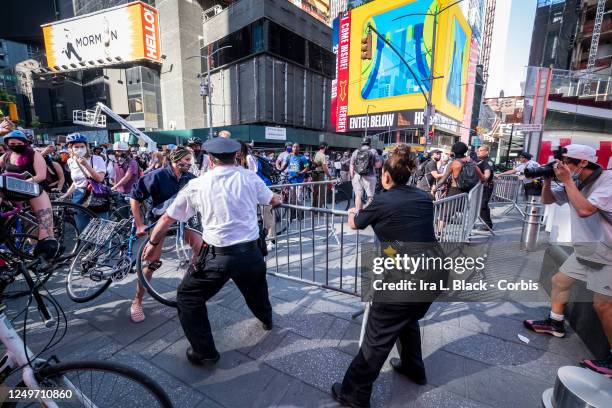 New York Police Department try to hold the barricade line against protesters that are trying to march peacefully through Times Square. This was part...