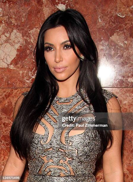 Kim Kardashian attends the Evening Sherri Hill Spring 2012 fashion show during Mercedes-Benz Fashion Week at Trump Tower Grand Corridor on September...