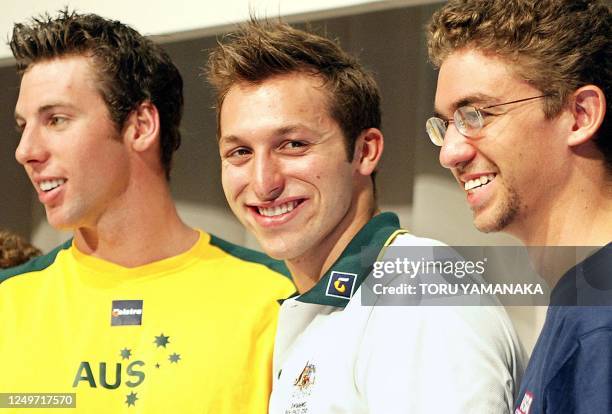 Australian swimmer Ian Thorpe smiles as he shares a light moment with his compatriot Grant Hackett and his rival American Anthony Irvin during a...