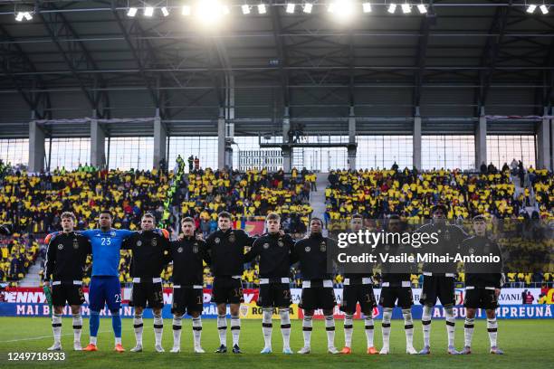 The German players sing the national anthem ahead the International Friendly match between U21 Romania and U21 Germany at Municipal Stadium on March...