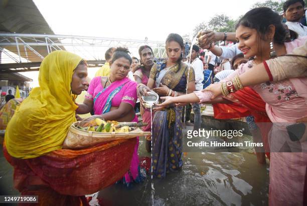 Transgender Chhath devotees perform rituals in Ganga river at Gandhi Ghat on the occasion of Chaiti Chhath Puja on March 28, 2023 in Patna, India.