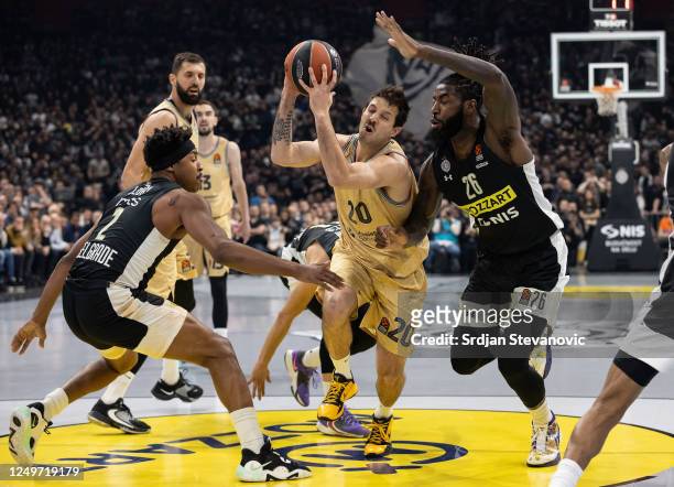 Nicolas Laprovittola of Barcelona in action against Mathias Lessort and Zach LeDay of Partizan during the 2022-23 Turkish Airlines EuroLeague Regular...