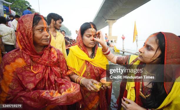 Chhath devotees perform rituals in Ganga river at Gandhi Ghat on the occasion of Chaiti Chhath Puja on March 28, 2023 in Patna, India.