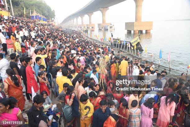 Chhath devotees gather at the bank of Ganga river at Gandhi Ghat on the occasion of Chaiti Chhath Puja on March 28, 2023 in Patna, India.