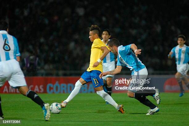 Neymar, from Brazil, fights for the ball with Canteros, from Argentina, during the first match of the Superclasico de la Americas at Mario Alberto...