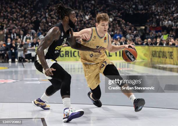 Rokas Jokubaitis of Barcelona in action against Mathias Lessort of Partizan during the 2022-23 Turkish Airlines EuroLeague Regular Season Round 31...