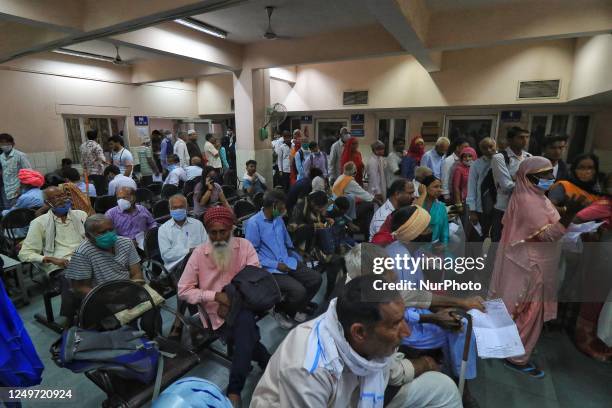 Patients wait to receive treatments at the OPD of SMS Hospital amid a strike of resident doctors over the Rajasthan Right to Health Bill, in Jaipur,...