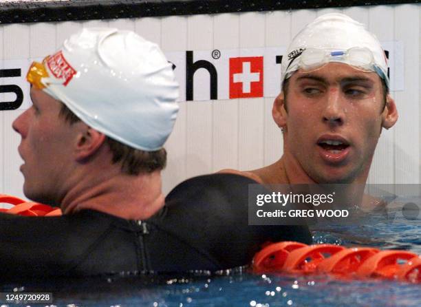 Grant Hackett casts a sideways glance at his main rival Kieren Perkins after the finish of the Men's 1500m Freestyle at the Australian Olympic...