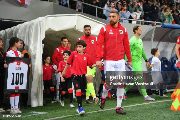 Guram Kashia, the captain of Georgia, leads Georgian national team on pitch during the UEFA EURO 2024 qualifying round group A match between Georgia...