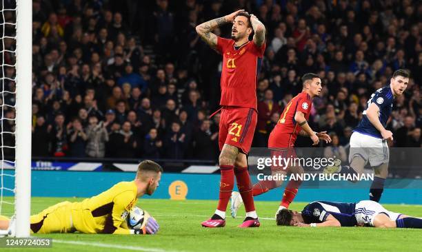 Spain's striker Joselu reacts as his header was saved by Scotland's goalkeeper Angus Gunn during the UEFA Euro 2024 group A qualification football...