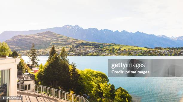 evening sunset scenics chilling from hotel resort seeing wide view in queenstown this is the most popular and famous tourist destination and attraction in new zealand. - standing water stock pictures, royalty-free photos & images