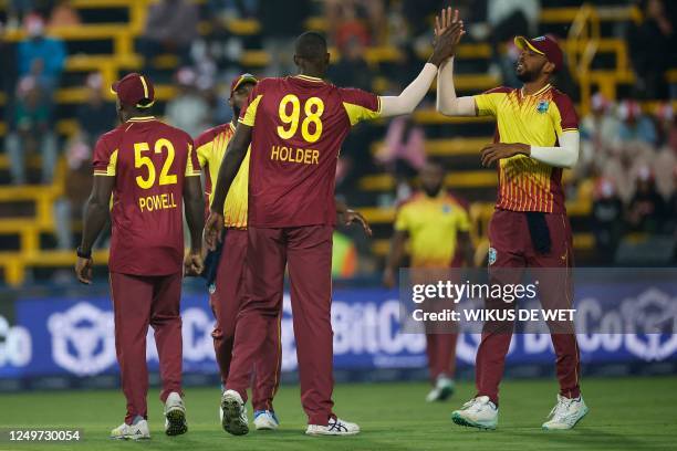 West indies' Jason Holder celebrates with teammates after the dismissal of South Africa's Rilee Rossouw during the third T20 international cricket...