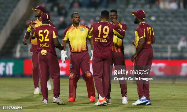 Sheldon Cottrell celebrates a catch of David Miller during the 3rd KFC T20 International match between South Africa and West Indies at DP World...