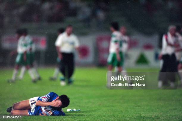Kazuyoshi Miura of Japan falls after the FIFA World Cup Asian Qualifier final round match between Iraq and Japan at the Al-Ahly Stadium on October...