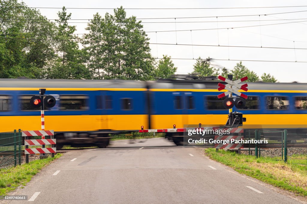 Train passing by a railway crossing