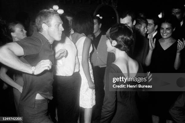 American actor Steve McQueen dancing with his wife, Neile Adams, at Le Bilboquet - a jazz club in Saint-Germain-des-Près, Paris, 17th September 1964....