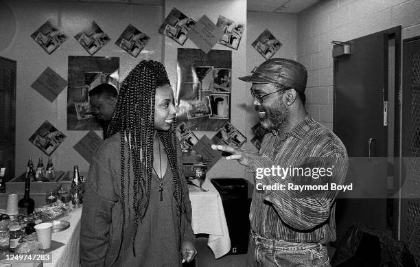 Frankie Beverly shares a conversation with Joi Marshall of Jade backstage at the U.I.C. Pavilion in Chicago, Illinois in December 1993.