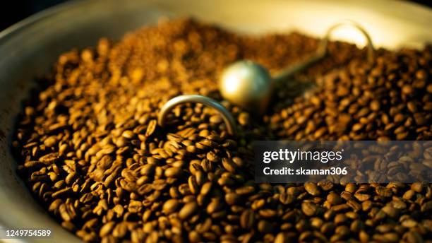 coffee roaster machine still roasting african coffee bean - kenya coffee stock pictures, royalty-free photos & images