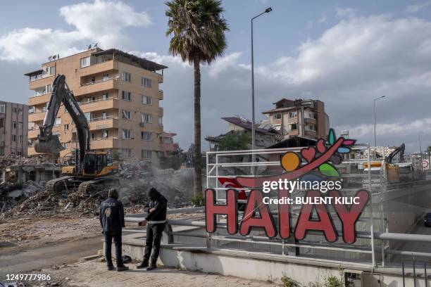 Turkish police officers stand in the centre of Hatay on March 28 after a 7.8-magnitude earthquake on February 6, 2023 killed more than 50,000 in...