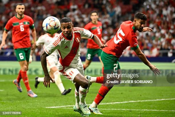 Peru's Andy Polo vies with Morocco's defender Yahia Attiyat Allah during the friendly football match between Morocco and Peru at the Wanda...