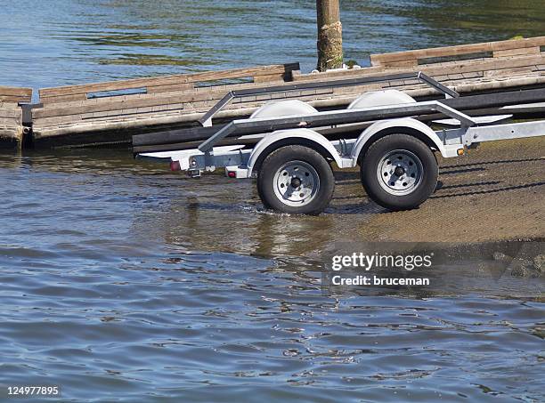 boat trailer entering water - ship launch stock pictures, royalty-free photos & images