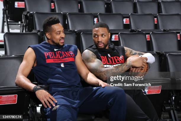 McCollum of the New Orleans Pelicans and Damian Lillard of the Portland Trail Blazers looks on before the game on March 27, 2023 at the Moda Center...