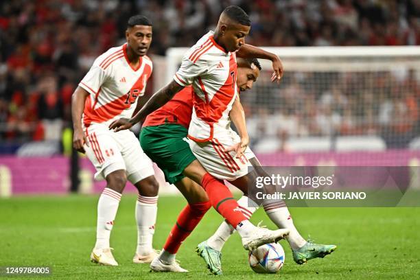 Morocco's midfielder Abdelhamid Sabiri vies with Peru's Andy Polo during the friendly football match between Morocco and Peru at the Wanda...