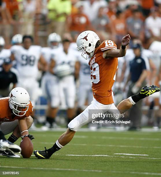 Place kicker Justin Tucker of the Texas Longhorns kicks an extra point against the BYU Cougars on September 10, 2011 at Darrell K. Royal-Texas...
