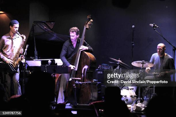 Jazz trio Fly, featuring saxophonist Mark Turner, bassist Larry Grenadier and drummer Jeff Ballard, perform live on stage at Ronnie Scott's Jazz Club...