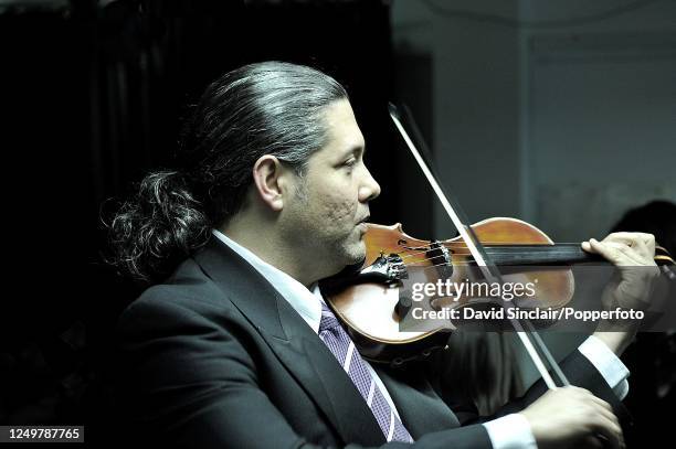Cuban violinist Gabriel Fonseca performs live on stage at the Barbican in London on 24th January 2010.