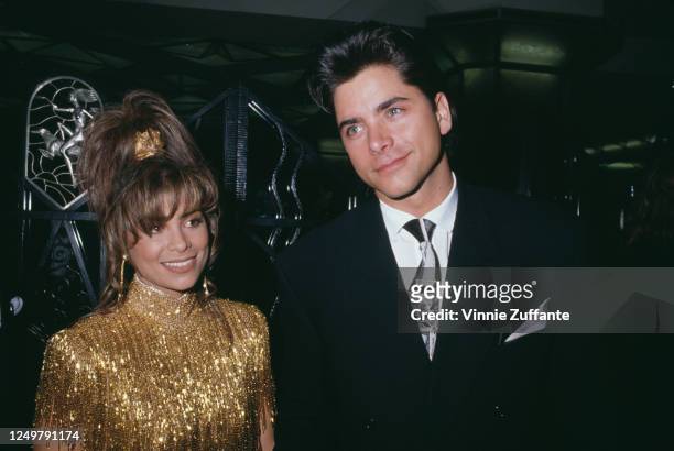 American singer and dancer Paula Abdul and American actor John Stamos attend the 32nd Annual Grammy Awards, held at the Shrine Auditorium in Los...