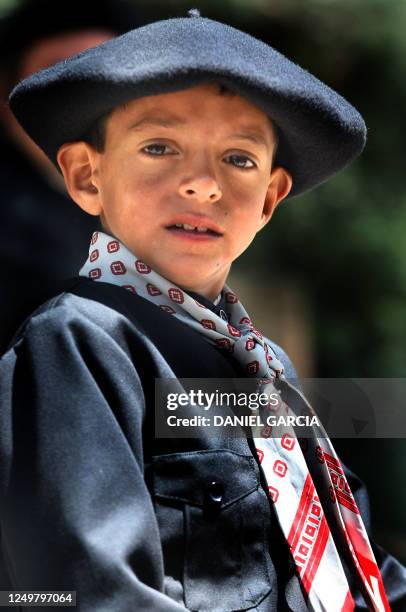 Gaucho boy poses for a picture in a gaucho's parade during the Tradition Day, in San Antonio de Areco, 110 km from Buenos Aires, 11 November 2007....