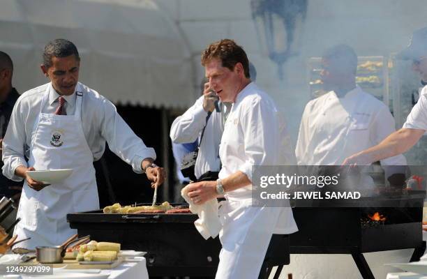 President Barack Obama cooks on the South Lawn with chef Bobby Flay at the White House in Washington, DC, on June 19, 2009 for young men from local...