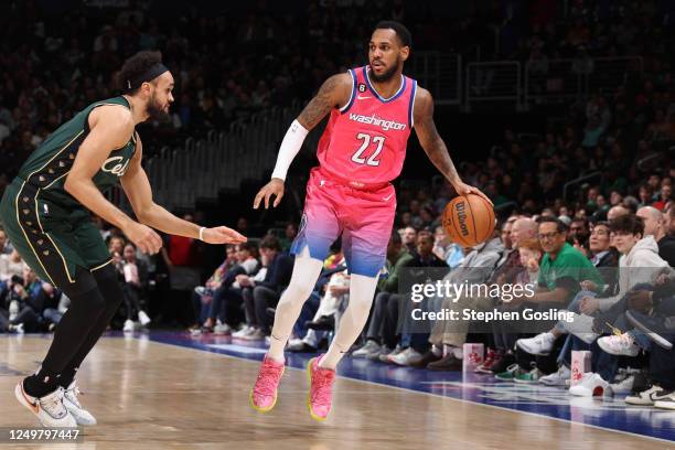 Monte Morris of the Washington Wizards dribbles the ball during the game against the Boston Celtics on March 28, 2023 at Capital One Arena in...